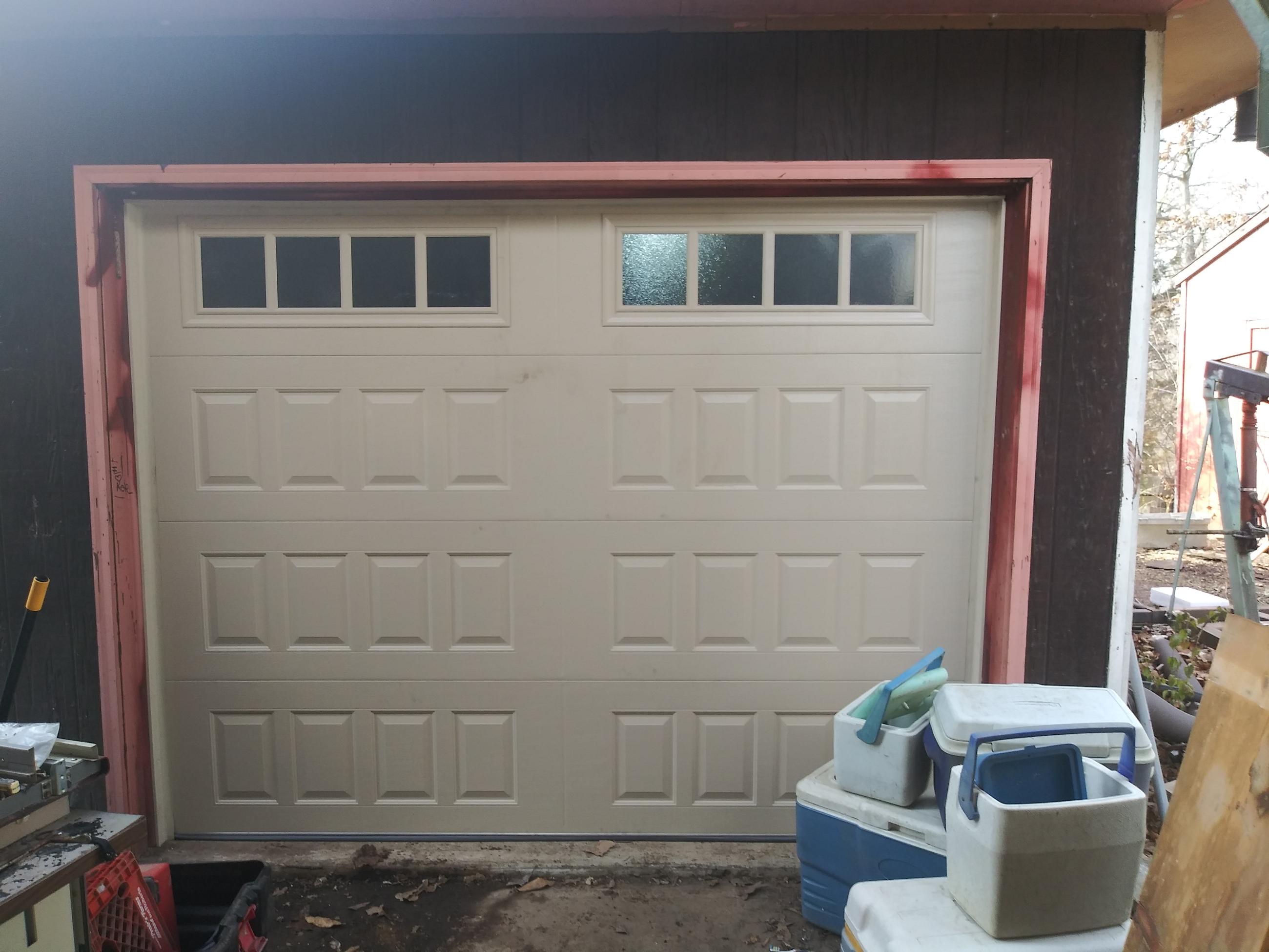 Garage door spring replacement in progress
