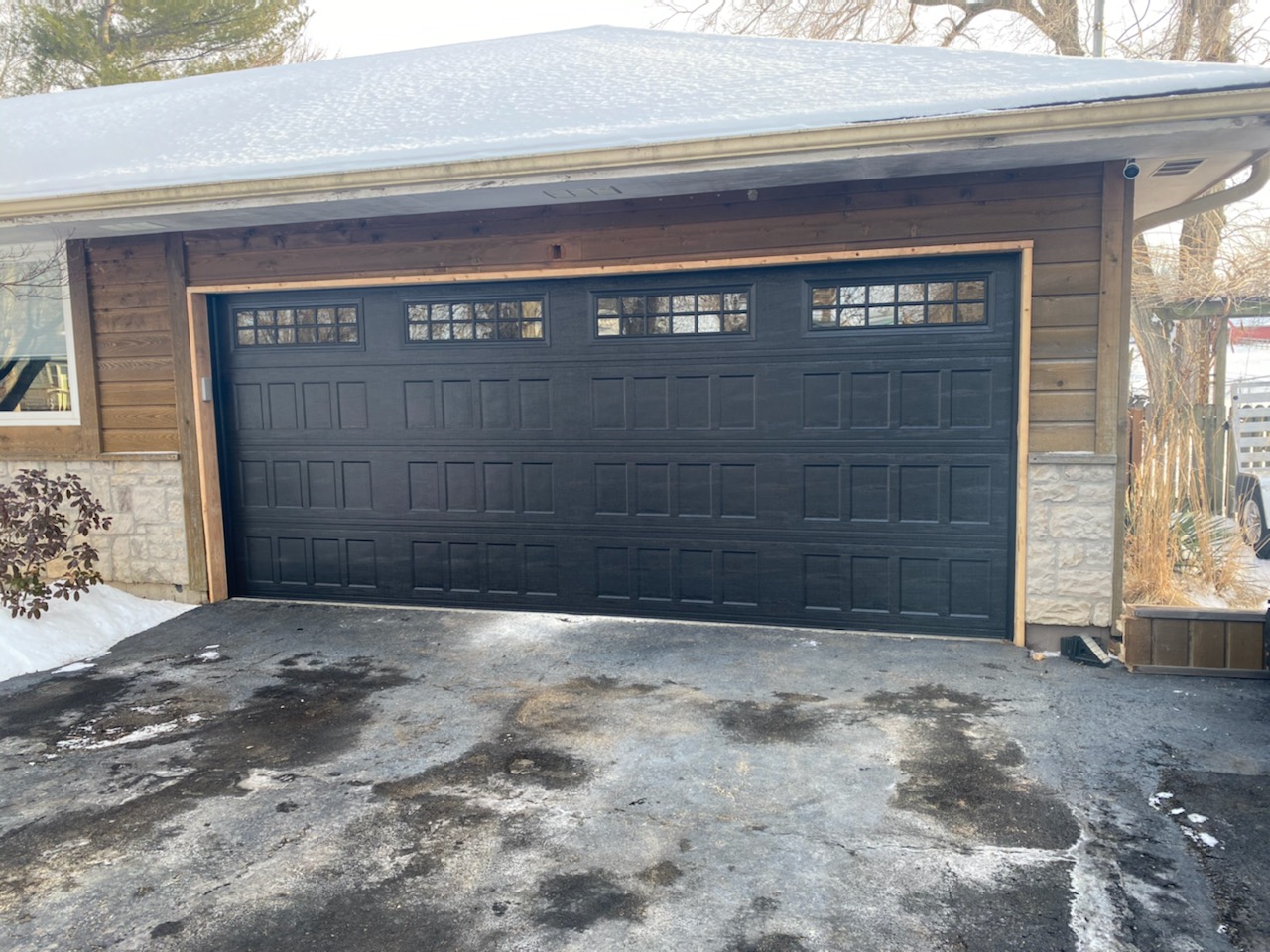 Completed garage door spring replacement with safety inspection