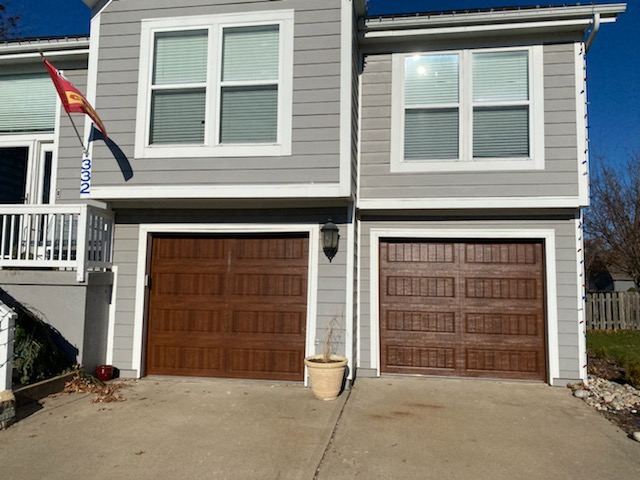 Close-up of garage door cable drum and cable system