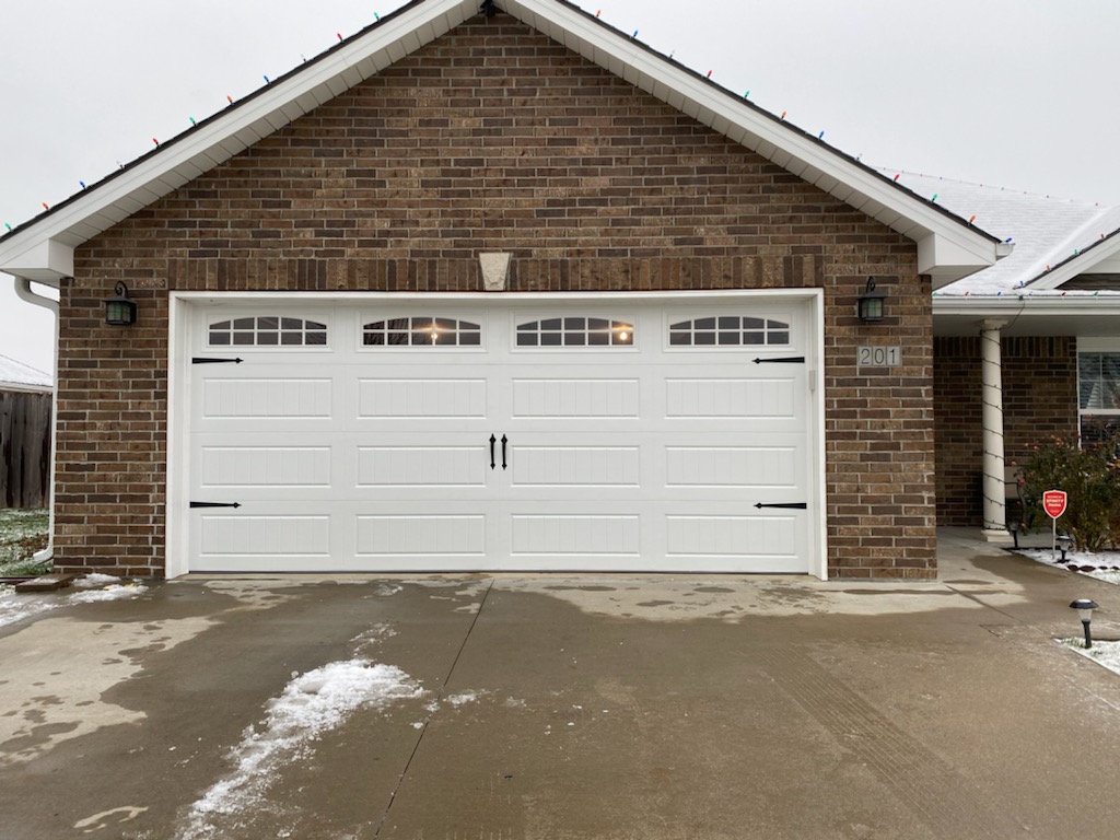 Nylon garage door rollers installed on residential door